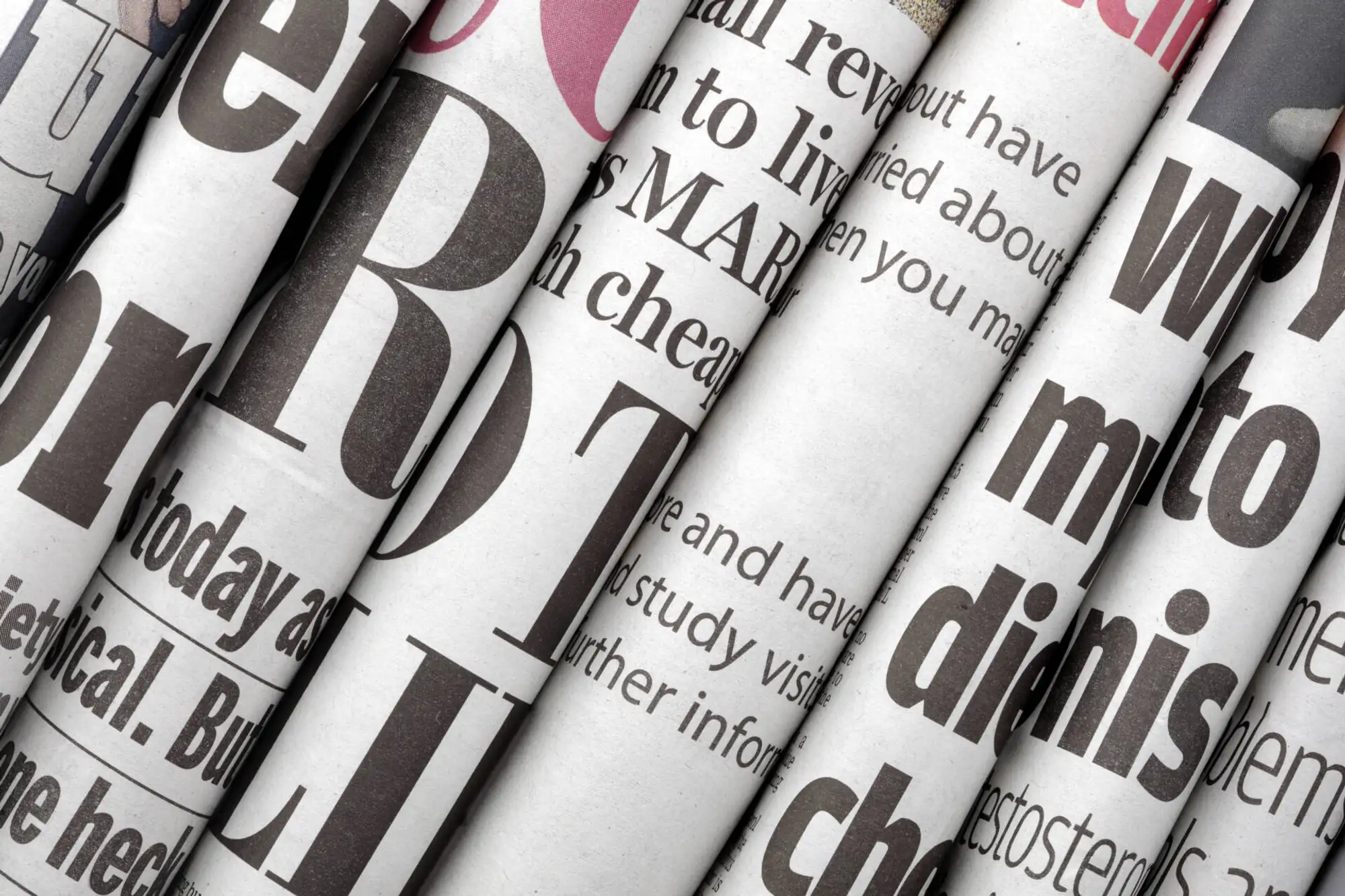 closeup up of stack of folded newspapers